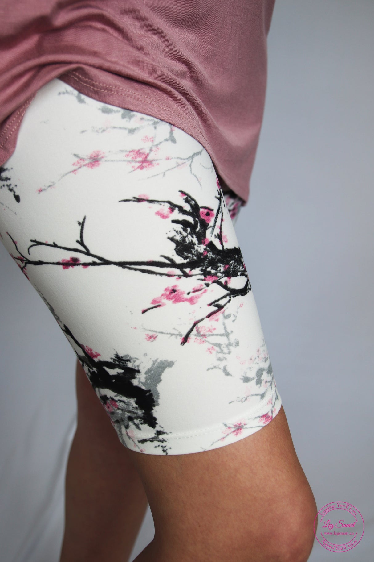 White shorts splashed with multiple shades of black and perfectly subtle hints of pink to add interest