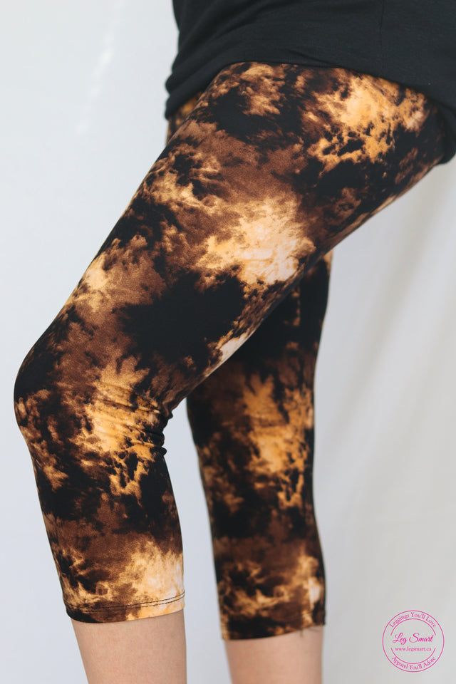 gold and black printed leggings